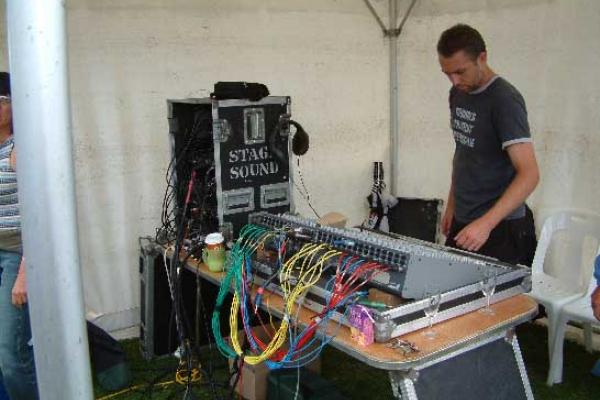 Ian engineering an outdoor concert and wondering what all those knobs are for!